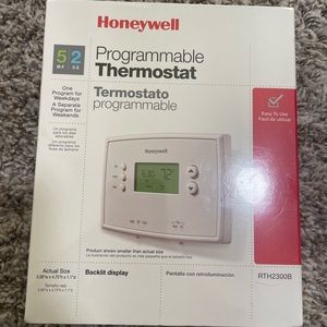 New, still sealed, programmable thermostat.